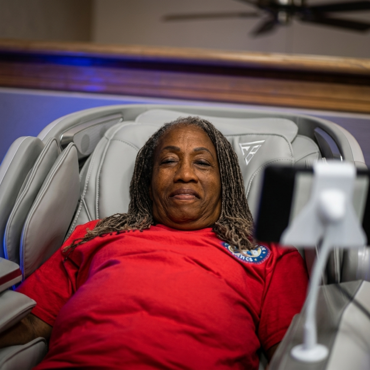 Veteran athlete relaxing in a massage chair during the 2026 National Veterans Golden Age Games.