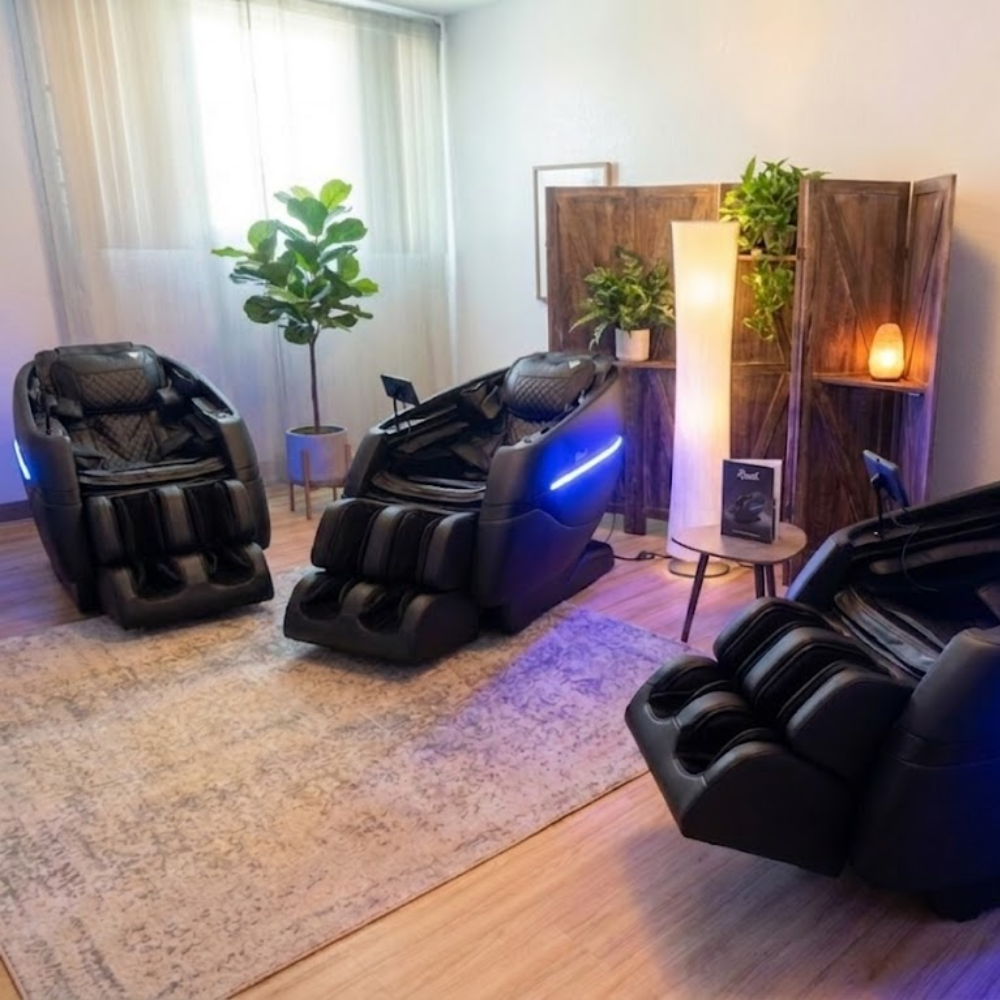 Completed commercial wellness room setup featuring three Floridian Brand Rebel 4D massage chairs for institutional and corporate recovery programs.