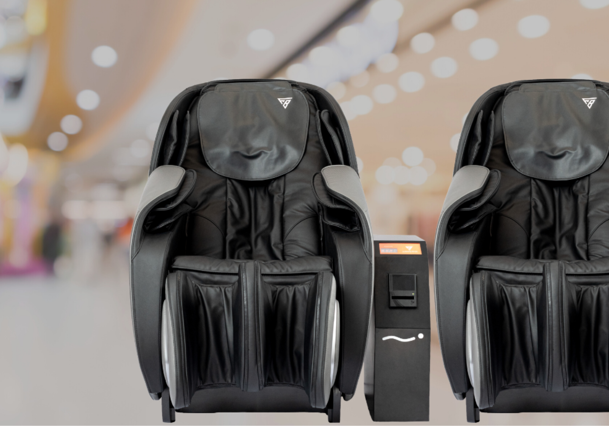 Black massage chair with control panel on a blurred indoor background