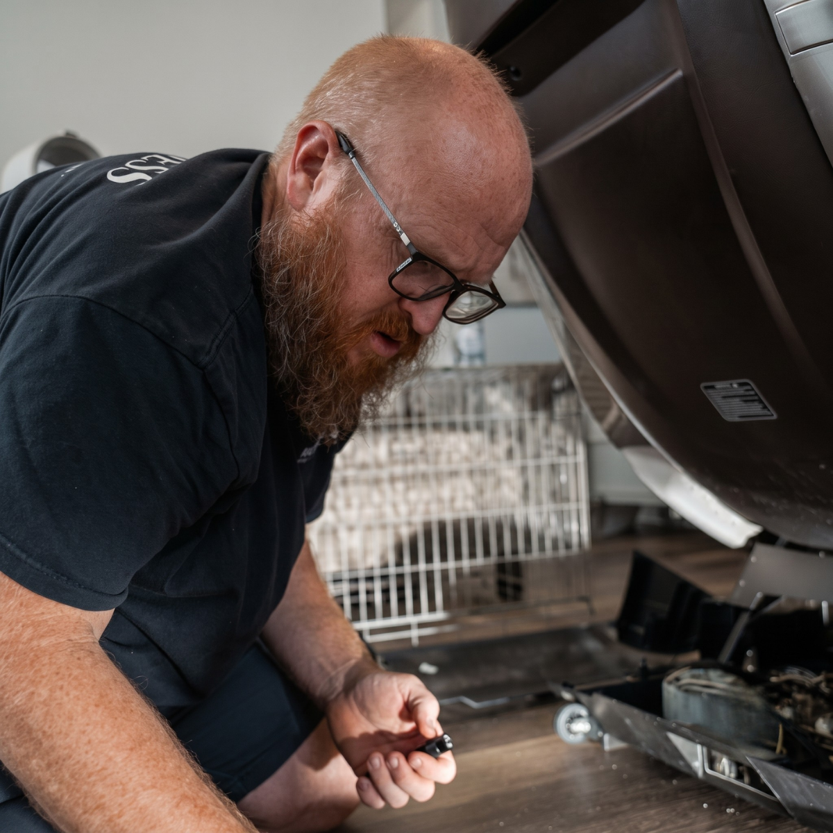 Professional technician providing massage chair service and repair through Floridian Brand ONE