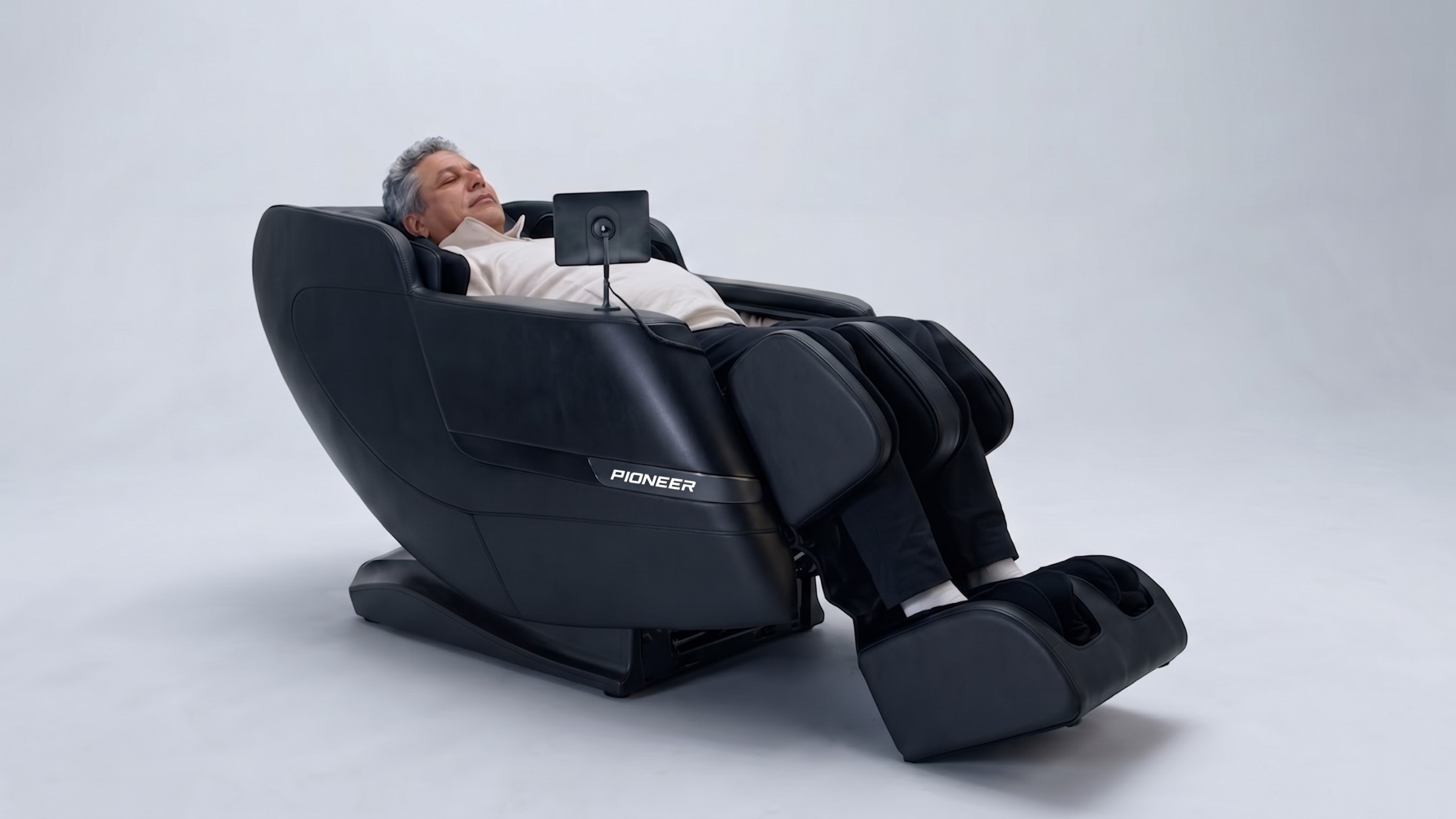 Pioneer 6D massage chair performing Ultimate Full-Body Stretch with leg extension and spinal decompression.