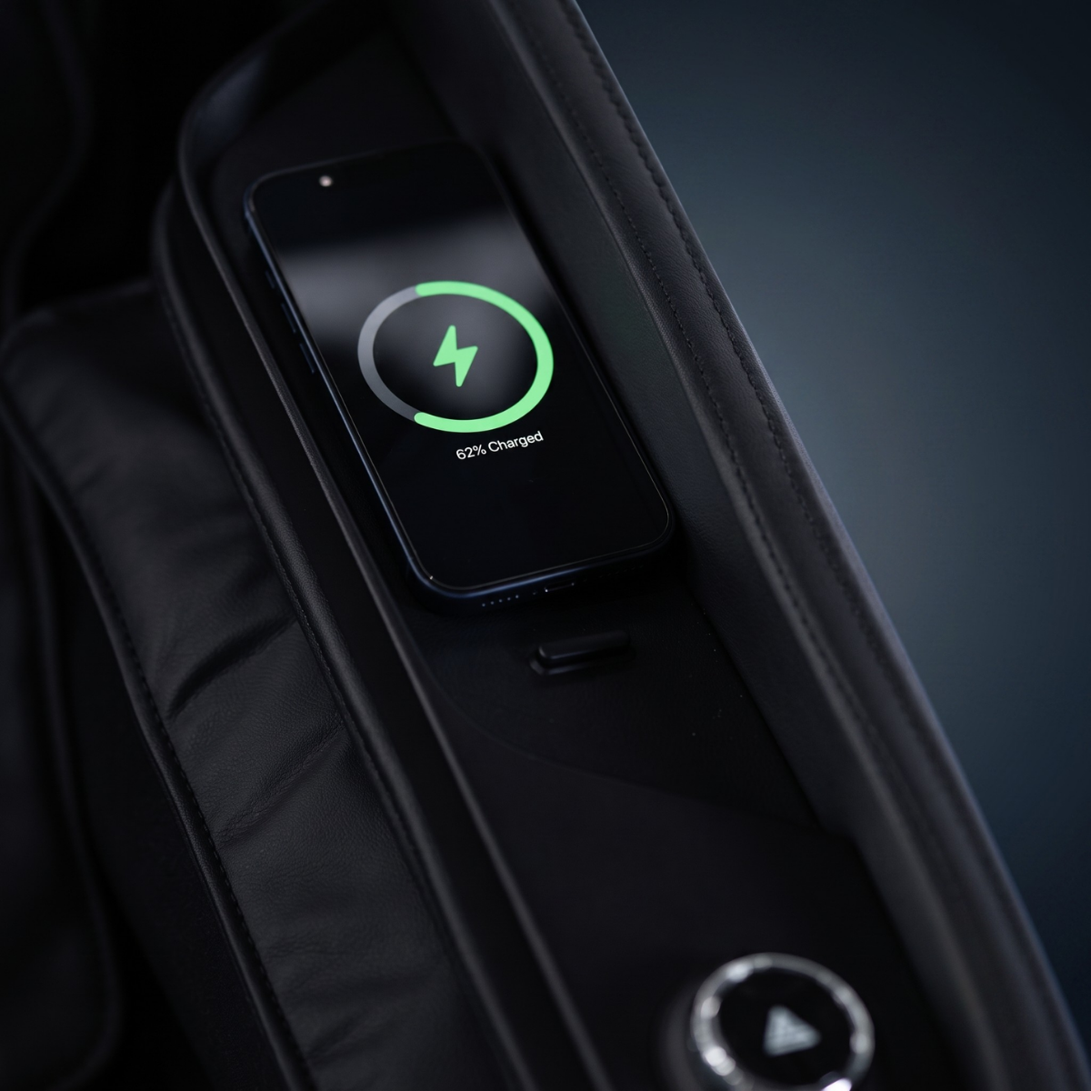 Rebel 4D massage chair built-in wireless charging station for keeping a phone powered during massage sessions